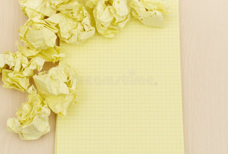 Notebook and crumpled paper