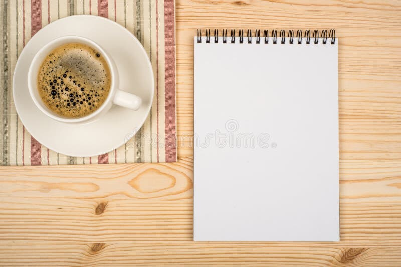 Notebook and cup of coffee