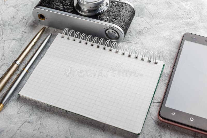 Notebook with film camera. stock photo. Image of empty 83866744