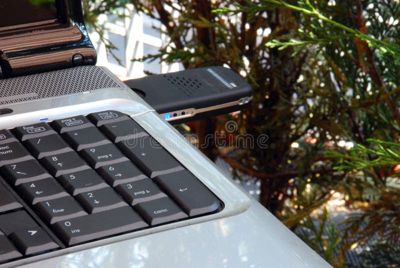 Notebook with modem Usb 3G key stock photography