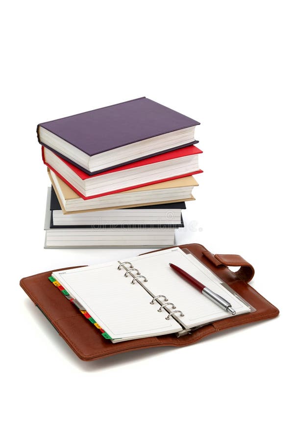 Notebook, pen and books stock photos