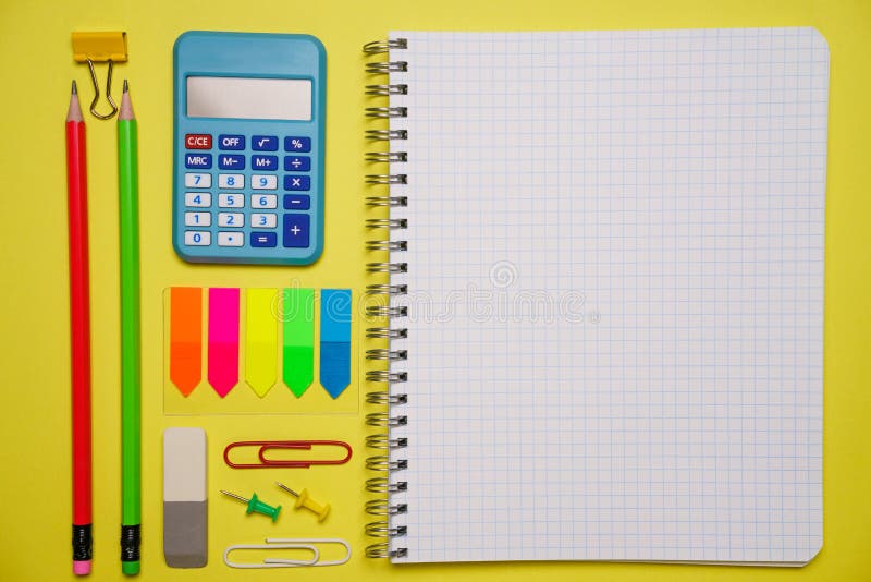Notebook with a pen and colorful notes on a blue and orange background. royalty free stock photo