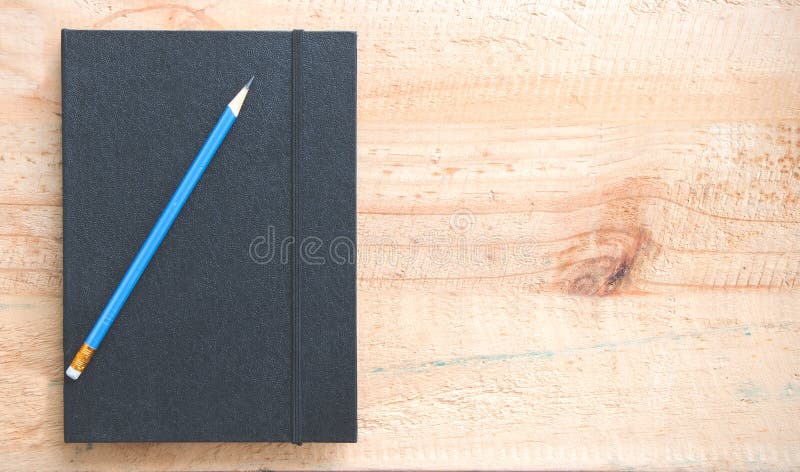 Notebook and pencil royalty free stock photo