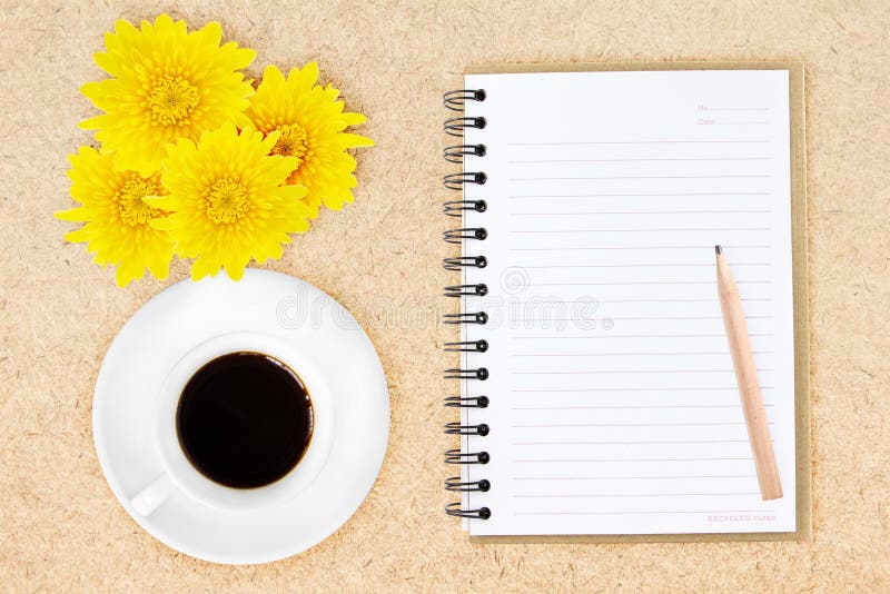 Notebook pencil coffee and flowers