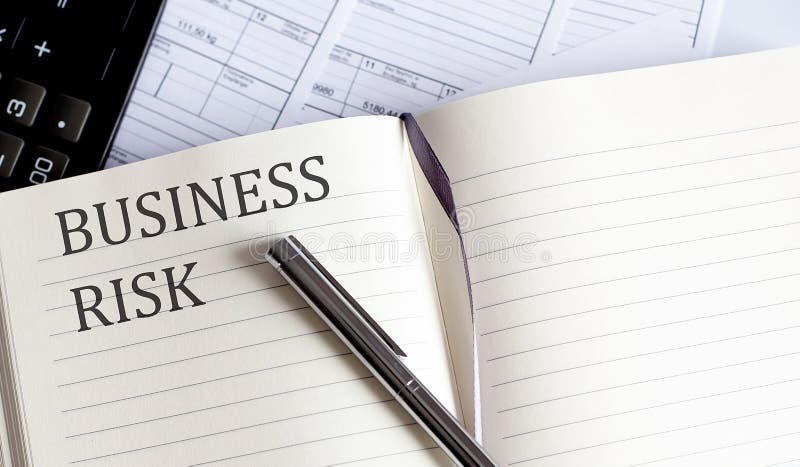 Notebook with Toolls and Notes about BUSINESS RISK royalty free stock photo