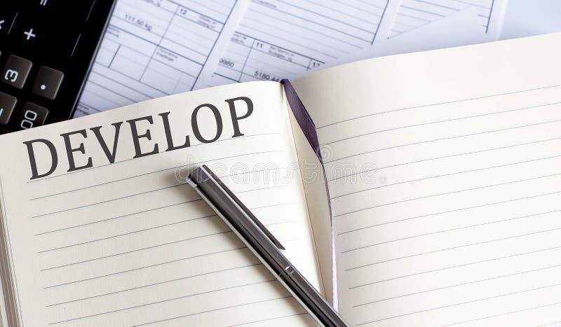 Notebook with Toolls and Notes about DEVELOP royalty free stock images