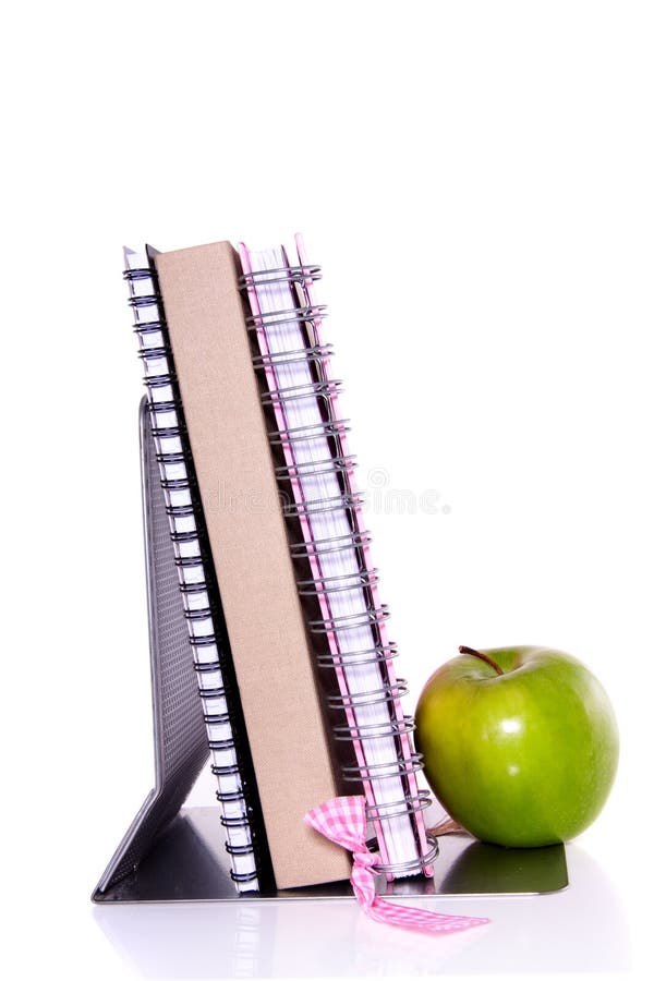 Notebooks and an apple