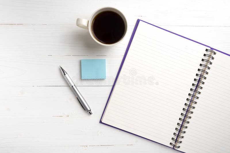 Notepad and coffee cup