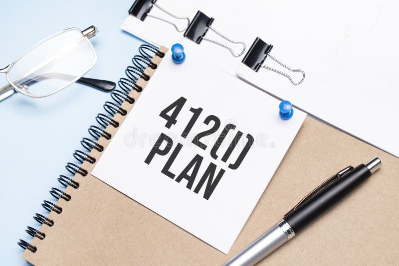 Notepad with 412 i plan text on the office table with glasses, notepad and paper with clips royalty free stock images