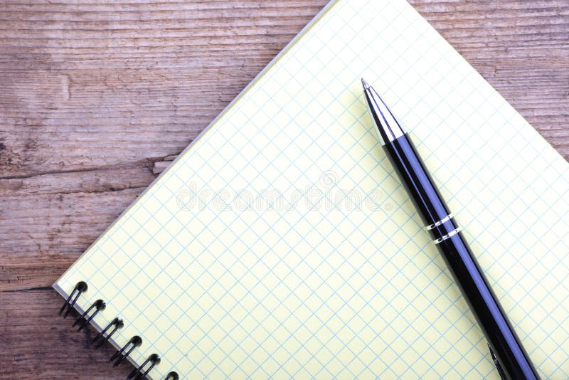 Notepad And Pen Closeup On Wooden Background