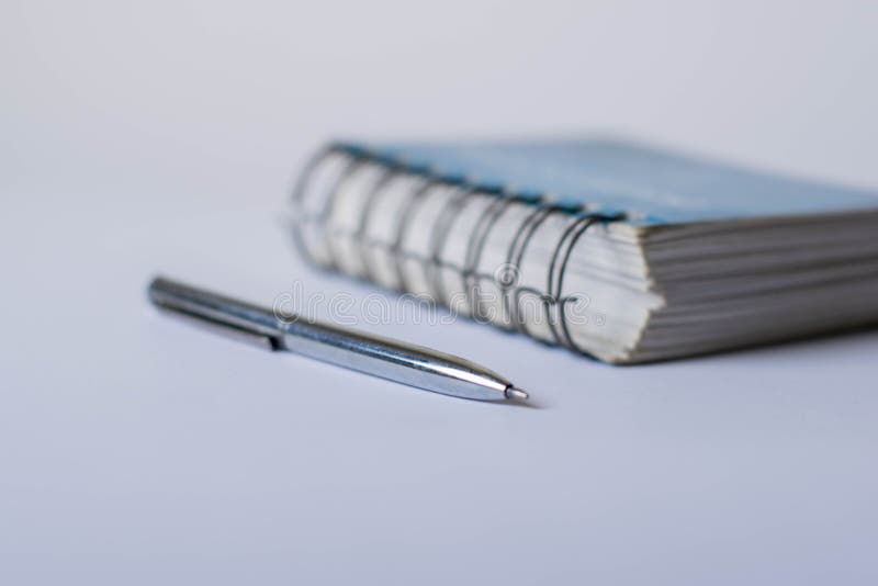 Notepad With Pen On White Background . Side View Stock Photo Image of