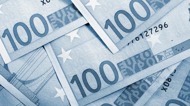 Notes of 100 euros closeup. Blue tinted background about economy and budget of European Union. News money wallpaper about euro.