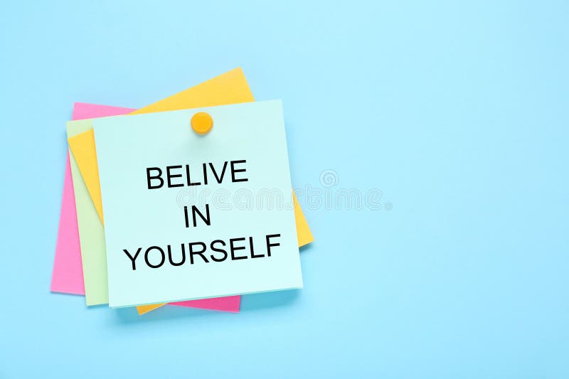 Notes with phrase Believe In Yourself on light blue background, top view. Motivational quote royalty free stock photography