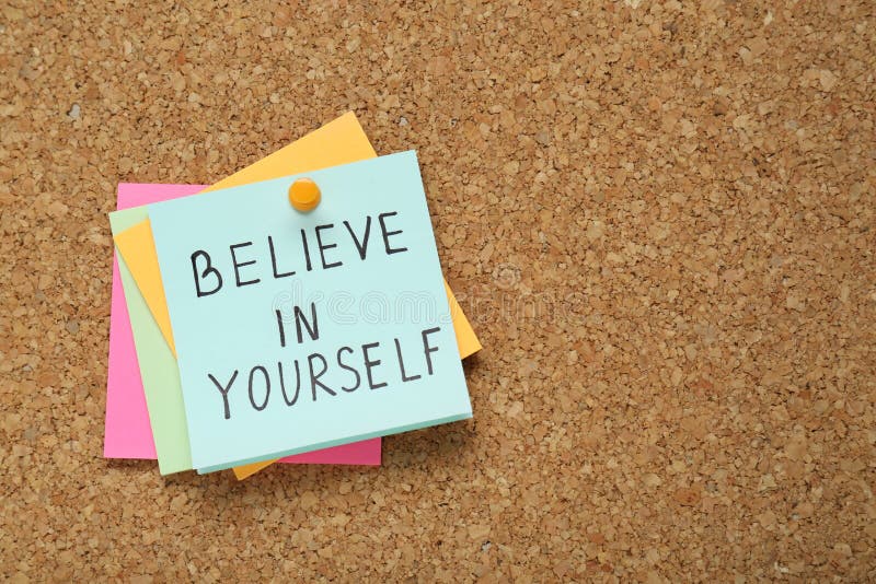 Notes with phrase Believe In Yourself and space for text on corkboard, top view. Motivational quote stock images