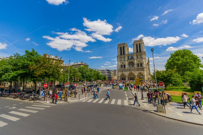 Paris, France - June 1, 2015: Notre Dame Cathedral, one of the largest and most well known church buildings in the world. Paris, France - June 1, 2015: Notre Dame Cathedral, one of the largest and most well known church buildings in the world