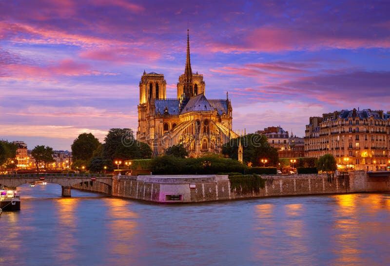 Notre Dame cathedral in Paris sunset from Seine river in France. Notre Dame cathedral in Paris sunset from Seine river in France