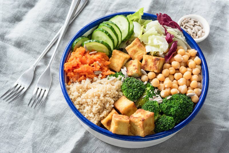 Nourishing buddha bowl with tofu, quinoa and vegetables royalty free stock images Nourishing buddha bowl with tofu, quinoa and vegetables royalty free stock images