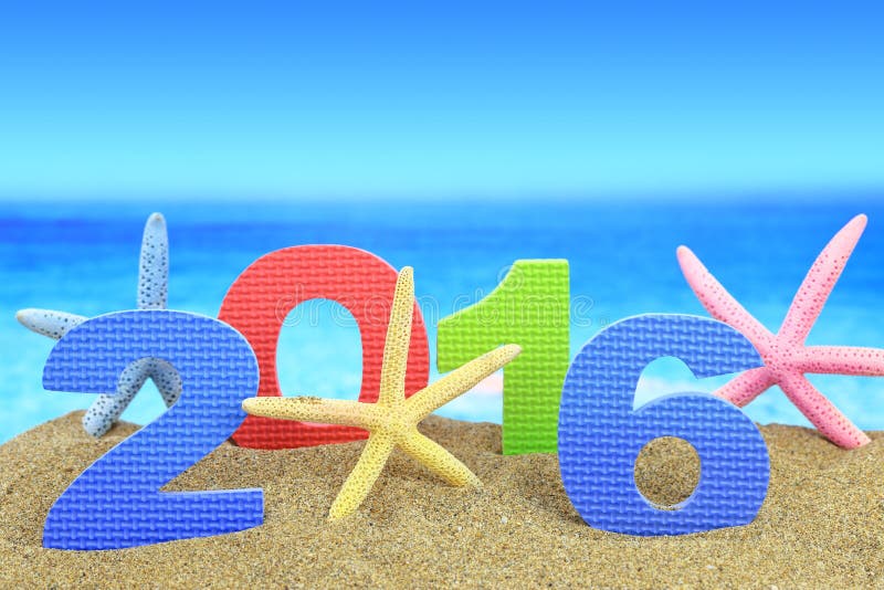 New year number 2016 and starfishes on the beach. New year number 2016 and starfishes on the beach