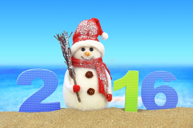 New year number 2016 and snowman on the beach. New year number 2016 and snowman on the beach