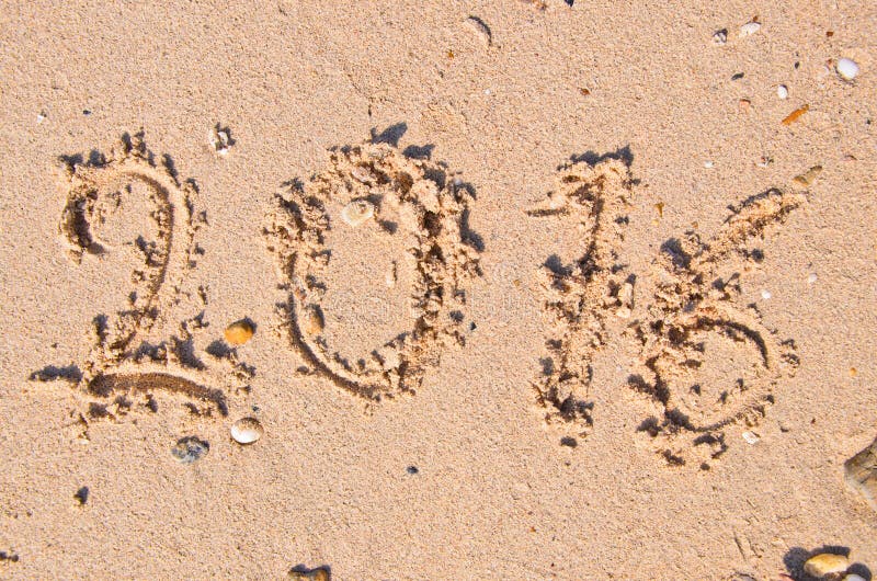 Nouvelles années de concept 2016 ; 2016 sur la texture de fond de sable image libre de droits Nouvelles années de concept 2016 ; 2016 sur la texture de fond de sable image libre de droits
