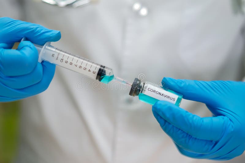 Novel Coronavirus 2019-nCoV Covid-19 vaccine development medical with syringe for doctor use to treat pneumonia illness patients at Wuhan, China