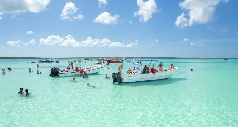 A Group of Tourists in the Caribbean Sea near Saona Island, Punta Cana, Dominican Republic, panoramic view.