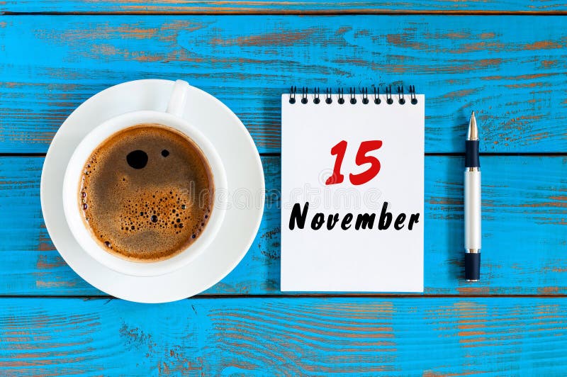 November 15th. Day 15 of month, hot coffee cup with calendar on accauntant workplace background. Autumn time. Empty. Space for text royalty free stock photography November 15th. Day 15 of month, hot coffee cup with calendar on accauntant workplace background. Autumn time. Empty. Space for text royalty free stock photography