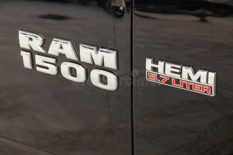 Black Dodge Ram with an engine of 5.7 liters front fender view with emblem 1500 Hemi on the car parking with snow background stock images Black Dodge Ram with an engine of 5.7 liters front fender view with emblem 1500 Hemi on the car parking with snow background stock images