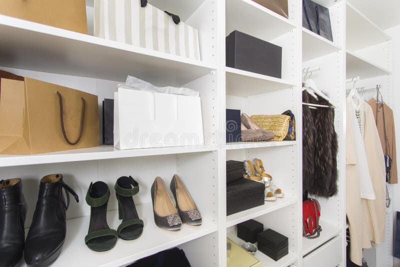 Modern walk in closet with luxury shoes and bags - Shopping beauty. Modern walk in closet with luxury shoes and bags - Shopping beauty