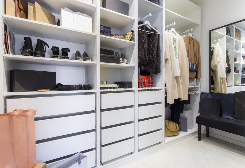 Modern walk in closet with luxury shoes and bags - Shopping beauty. Modern walk in closet with luxury shoes and bags - Shopping beauty