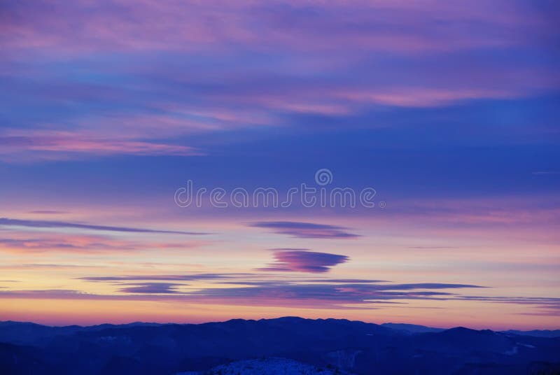 Colored clouds at sunrise over the mountains. Colored clouds at sunrise over the mountains