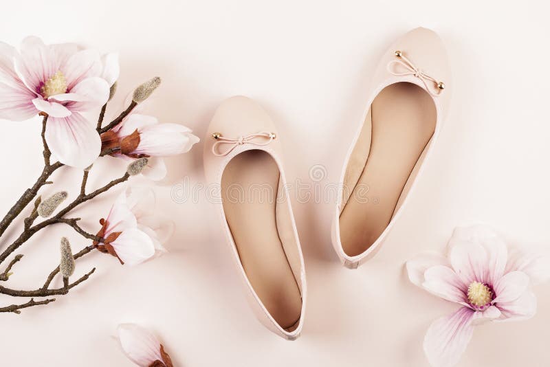 Nude colored ballerina shoes and magnolia flowers