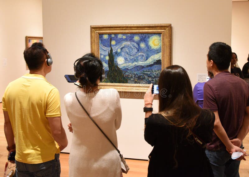 New York, USA - June 8, 2018: People near the Starry Night by Vincent van Gogh painting in Museum of Modern Art in New York City. New York, USA - June 8, 2018: People near the Starry Night by Vincent van Gogh painting in Museum of Modern Art in New York City.