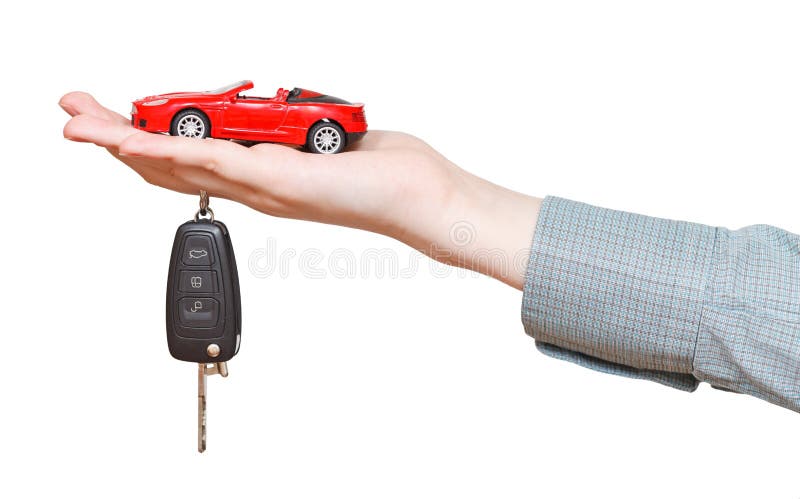 Nuevo coche rojo con llave a mano aislado foto de archivo Nuevo coche rojo con llave a mano aislado foto de archivo