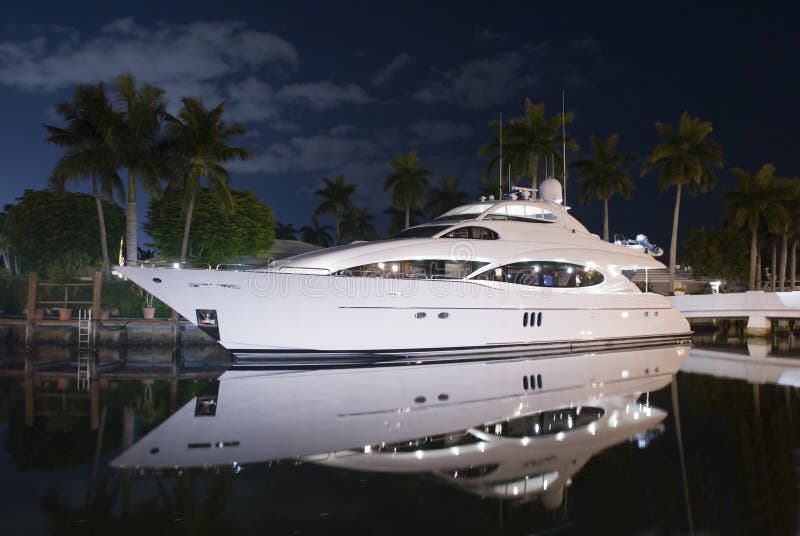 Night shot of luxury yacht with reflection in the water. Night shot of luxury yacht with reflection in the water