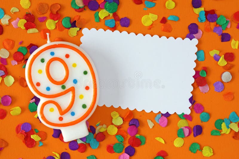 Number nine birthday candle. On orange background royalty free stock images Number nine birthday candle. On orange background royalty free stock images
