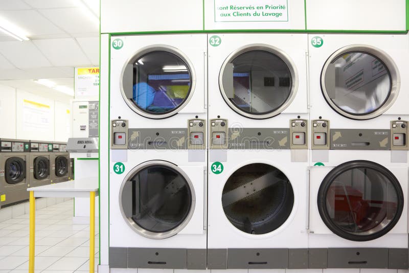 Number of white and gray washing machines stock image