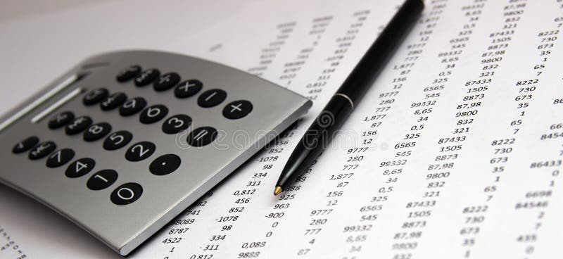 Numbers on paper, a pen and a calculator stock image Numbers on paper, a pen and a calculator stock image