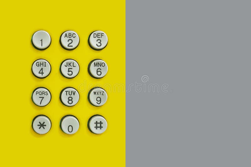 Numeric keypad of phone on the yellow background and have Gray Paper on the side for the design in technology backdrop