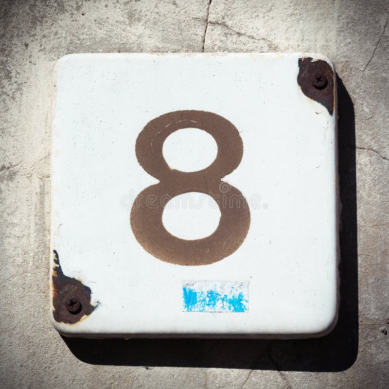 House number eight, grungy old painted metal plate with number. House number eight, grungy old painted metal plate with number