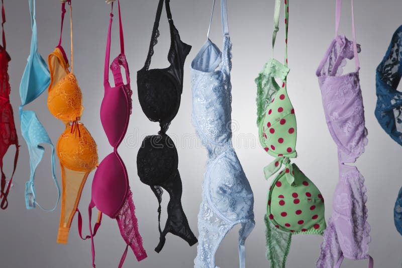 Row Of Bras Hanging In Lingerie Store Stock Photo, Picture and