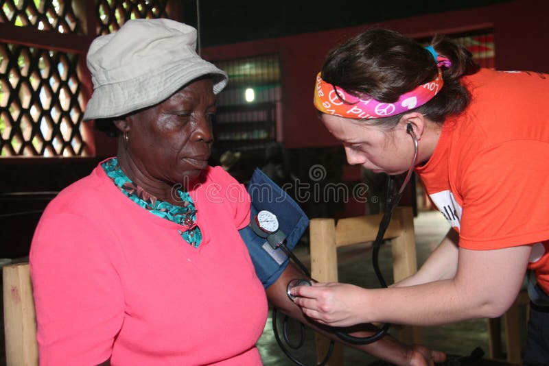 Nurse cares for Haitian patient. royalty free stock images Nurse cares for Haitian patient. royalty free stock images