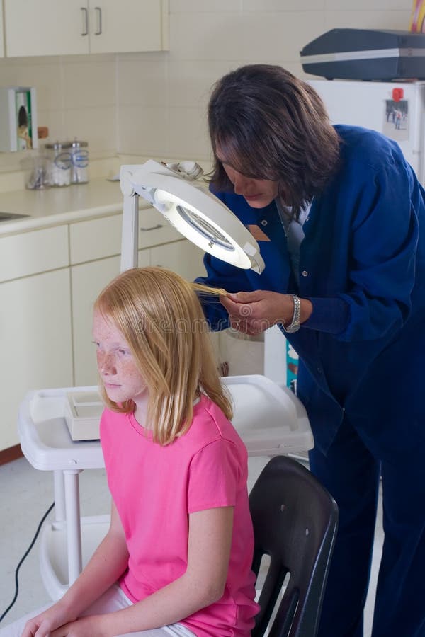 Nurse Checking for Head Lice Stock Photo Image of treatment, female