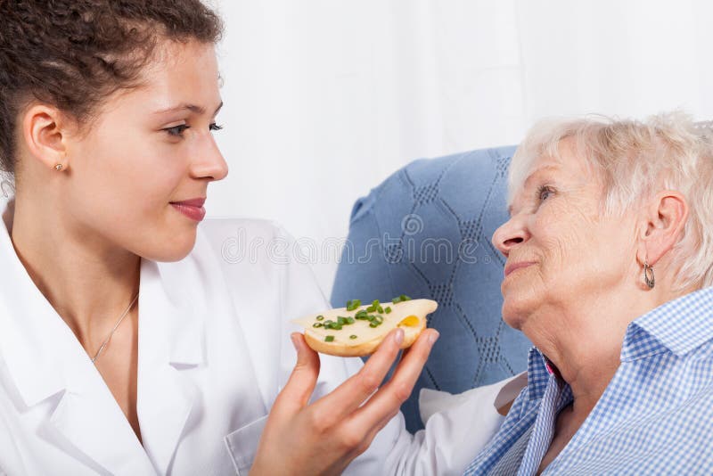Nurse Feeding Elderly Woman Stock Photo Image of nurse, disability