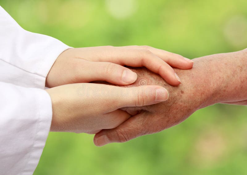 Nurse helping senior in nature