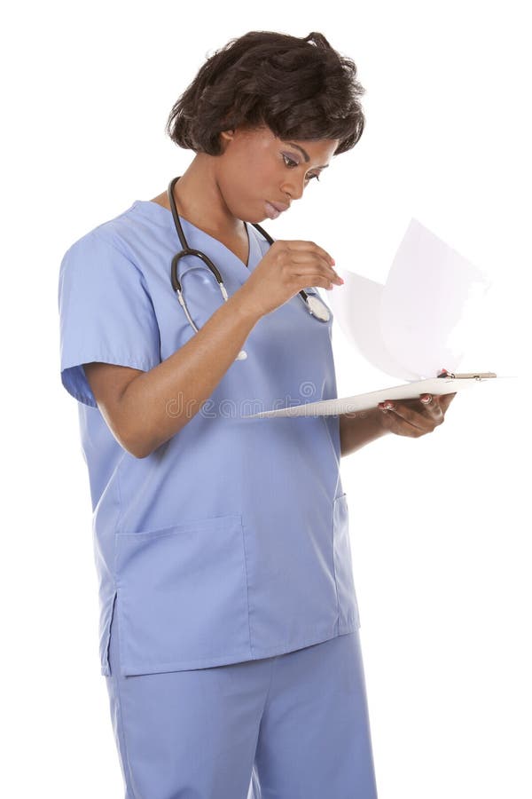 Black nurse wearing scrubs on white isolated background. Standing file folder stock images, royalty-free photos and pictures