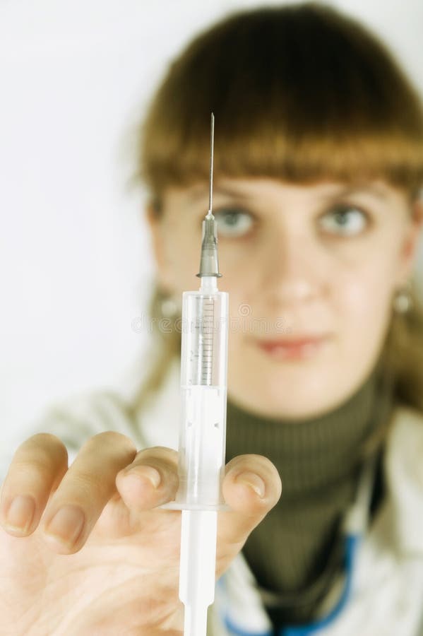 Nurse holding the syringe