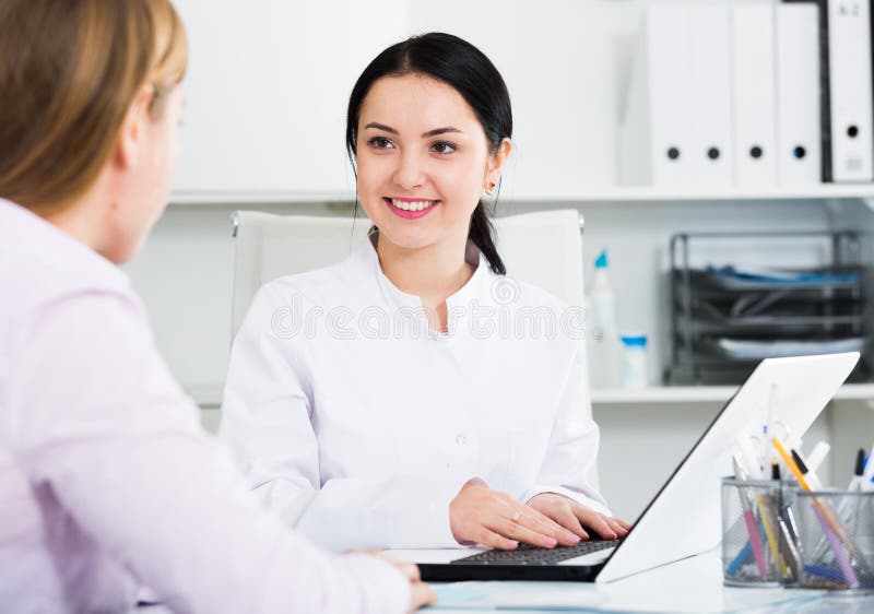 Nurse making appointment for client stock photography