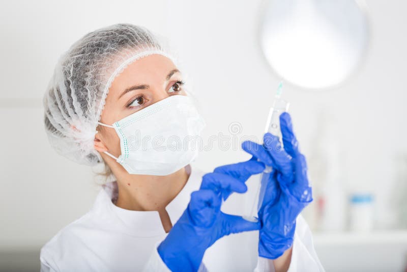 Nurse making injection stock images