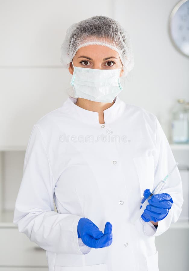 Nurse making injection stock photos